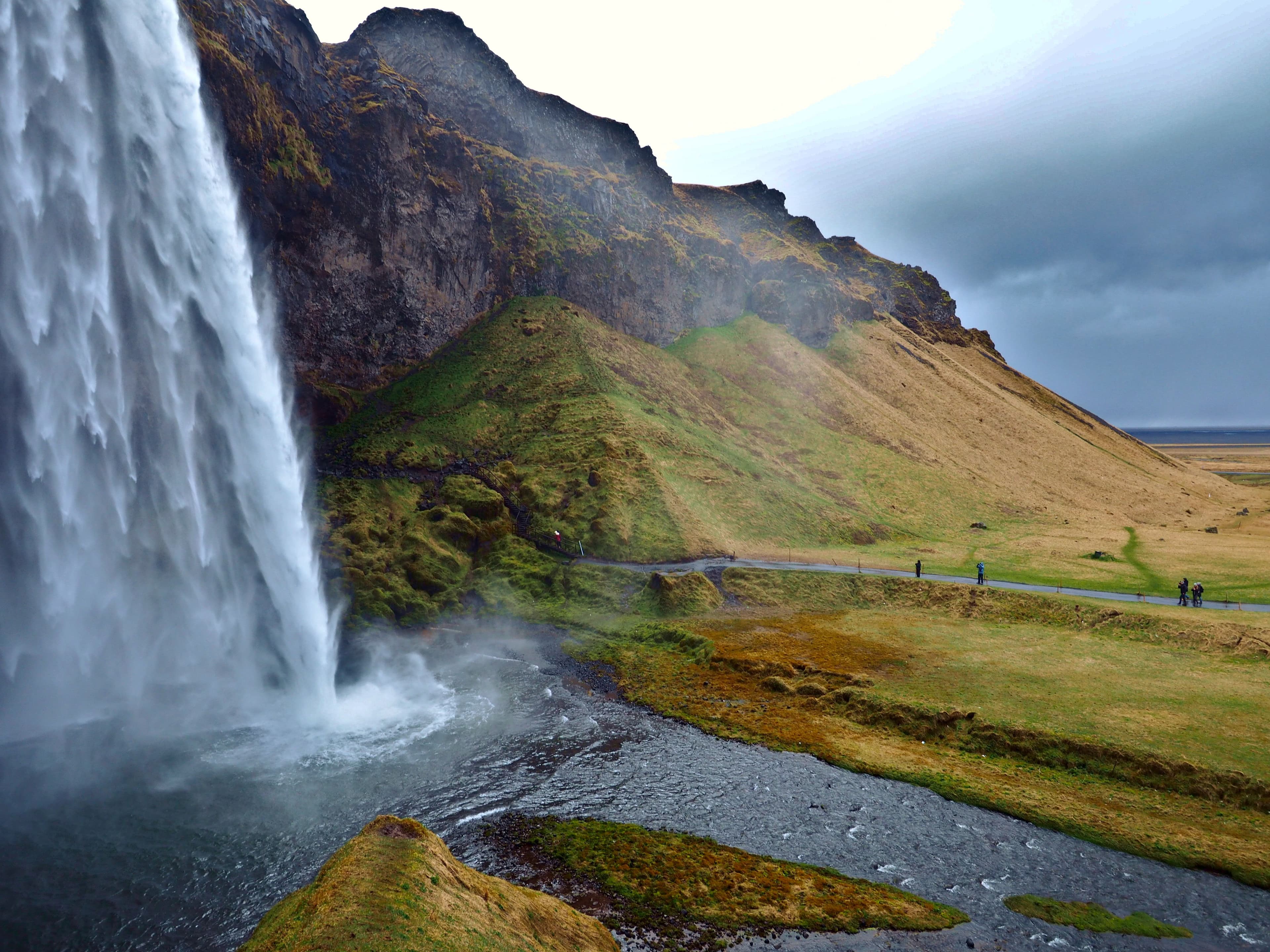 Cascading waterfall over rugged highlands