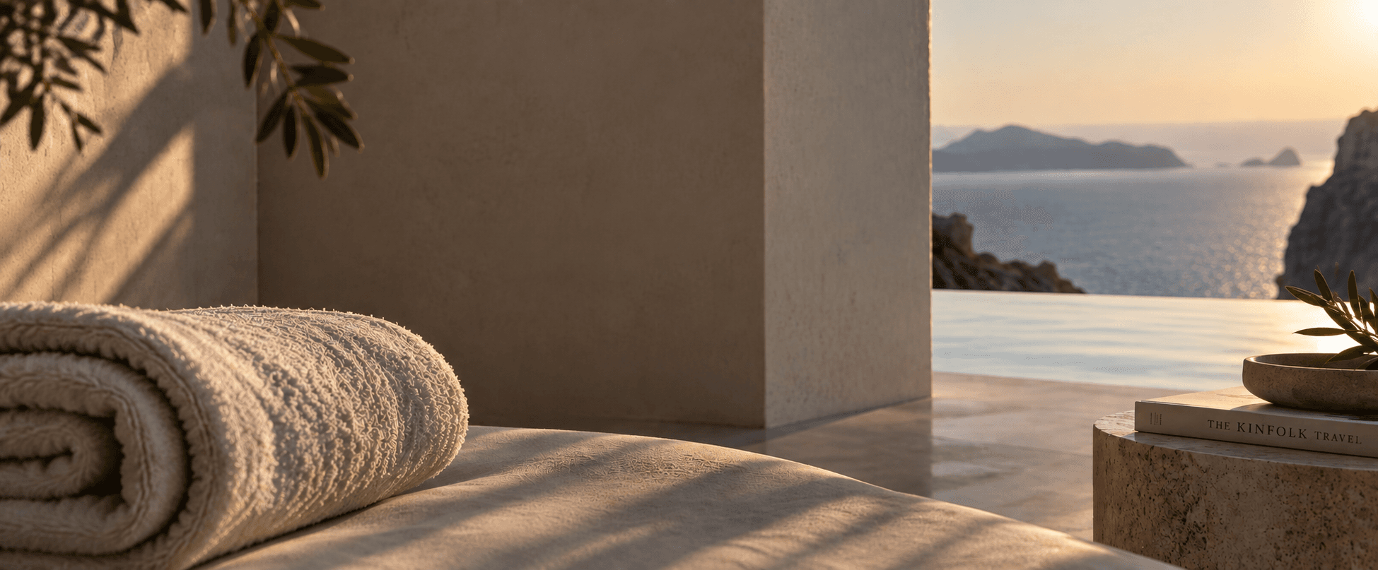 Cliffside villa terrace overlooking the Aegean sea at sunset